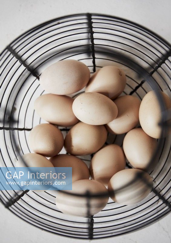 Detail of metal basket of fresh eggs