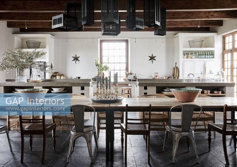 Large wooden dining table in country kitchen-diner
