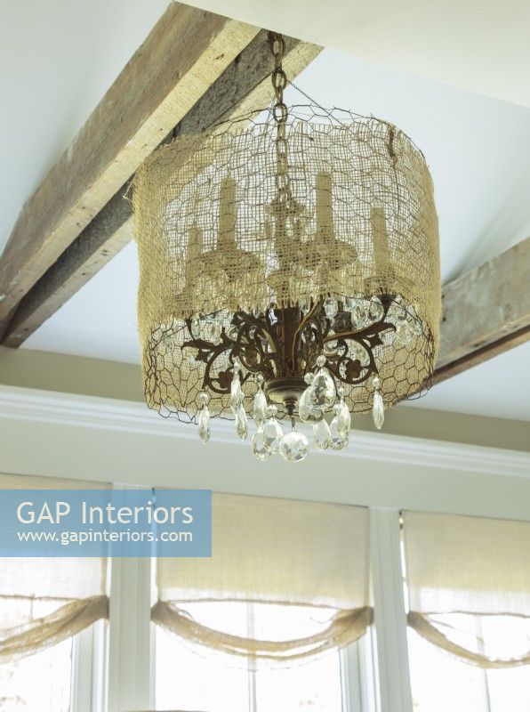 Airy netting adds a touch of whimsy to a classic chandelier.