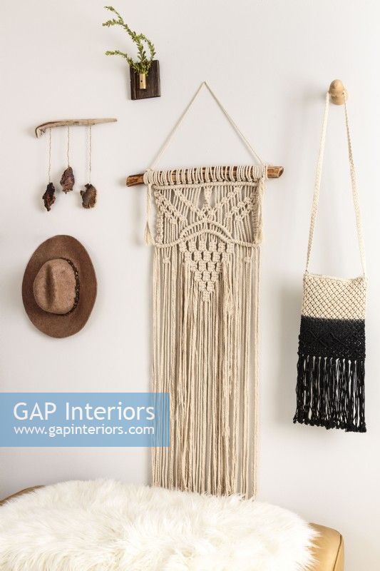 MacramÃ© is a common thread throughout Kateâ€™s decor; inexpensive and relatively simple to make by knotting string in patterns, it fills walls with an organic, homespun quality
