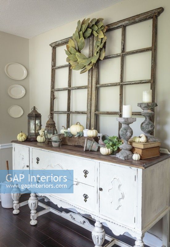 Kaylaâ€™s grandparents knew this antique sideboard was exactly the type of present their granddaughter would appreciate. Stripped and painted white, the piece is one of the dining roomâ€™s star attractions. It holds her collection of white Ironstone dishes, some of which is display as wall art.