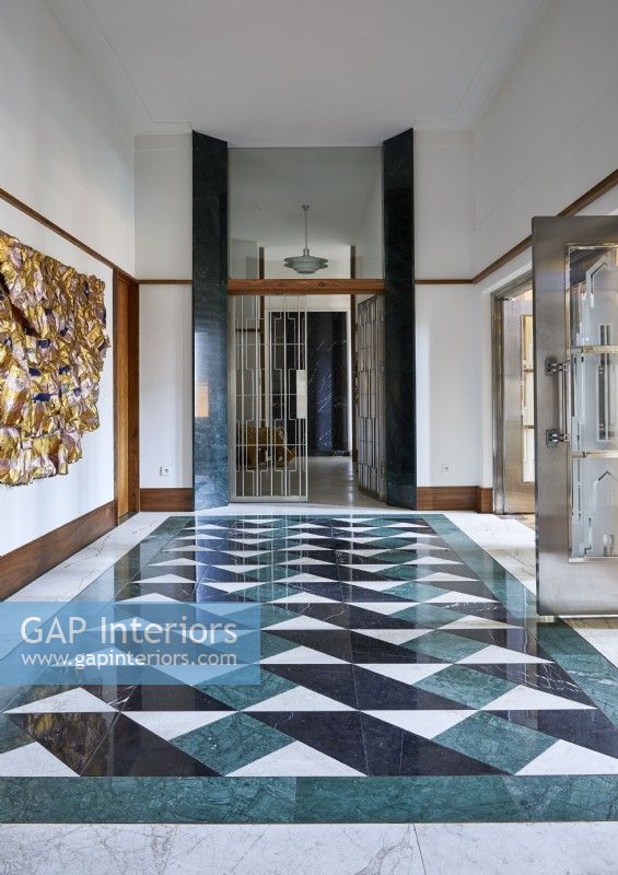 Patterned tiling in classic hallway