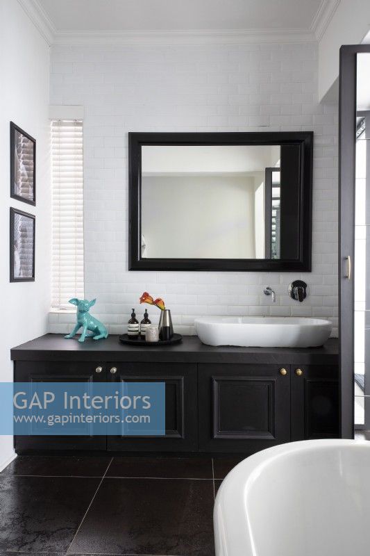 Black and white bathroom with built-in vanity