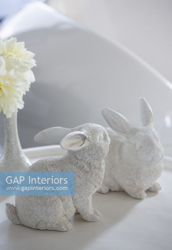 Decorative white ceramic rabbits