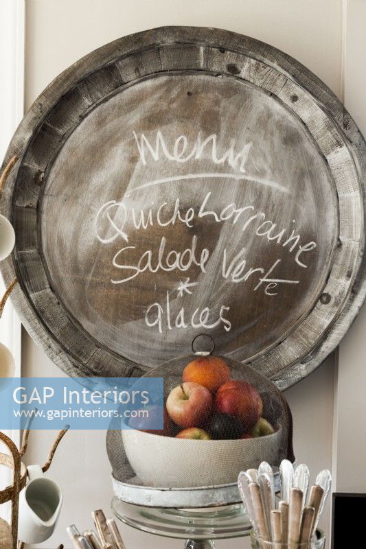 Function meets imagination in an easy to clean zinc platter turned blackboard for grocery lists, messages or menus. 