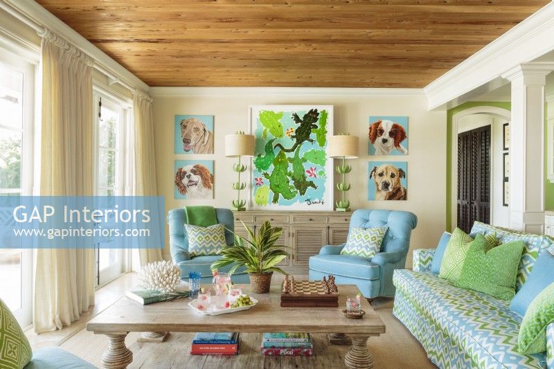 The family room takes its color cue from the water surrounding the home. 