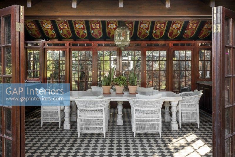 Garden room with folk art style painted ceiling