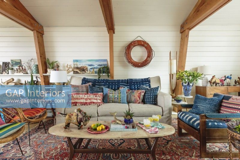  Assorted pillows and throws bring color and texture to the living room. 