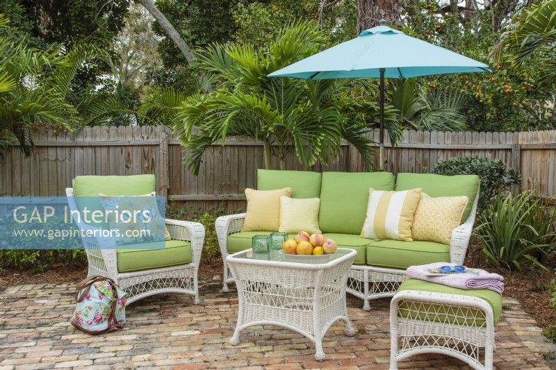 Patio setting with wicker furniture.