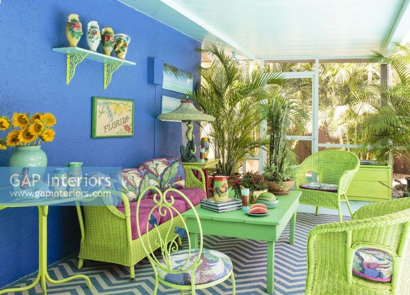 Colorful furnishings set a tropical mood in a another covered porch.