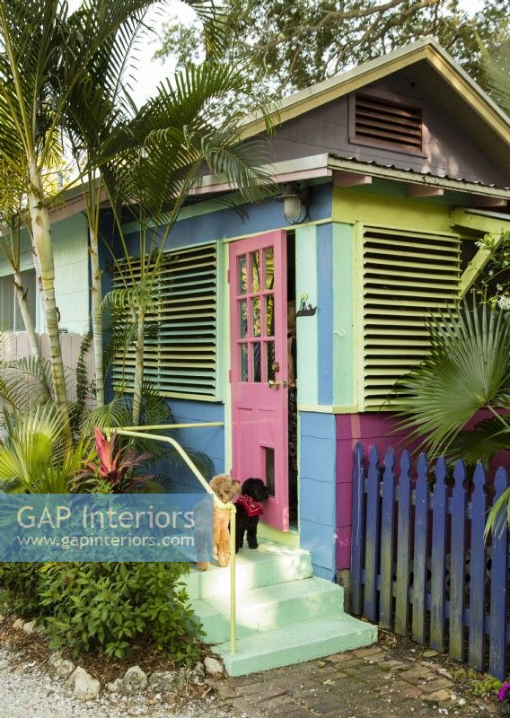 The color of the back porch entry evokes the cottages of Key West.