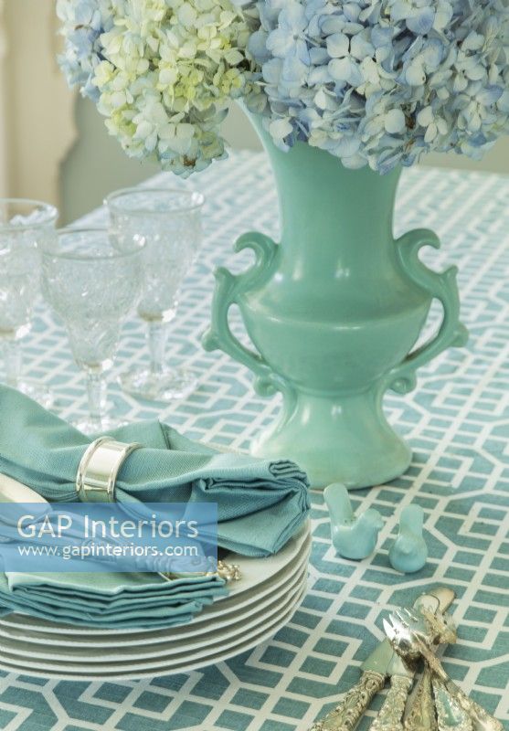 A blue 1940s vase and silverware are family heirlooms.