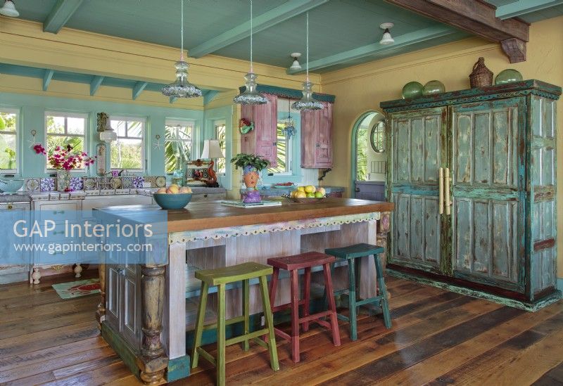 Faux painting transformed plain cabinetry into one-of-a-kind kitchen.