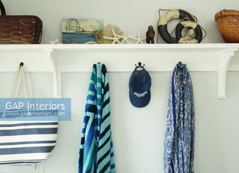 A deep plate rail and hooks add architecture, plus display space for basket storage and favorite finds.