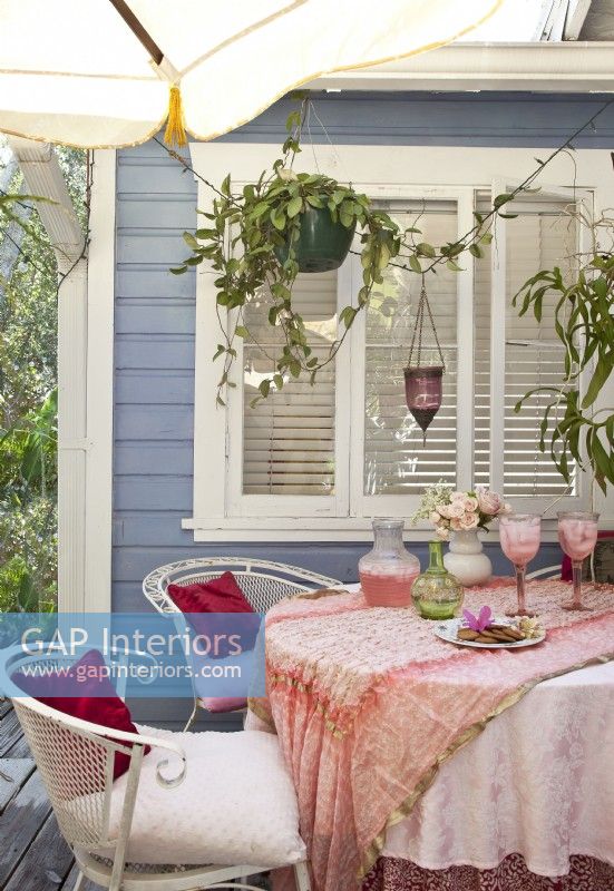 A sheltered deck off the kitchen is one of Nina's favorite outdoor spots for entertaining. 