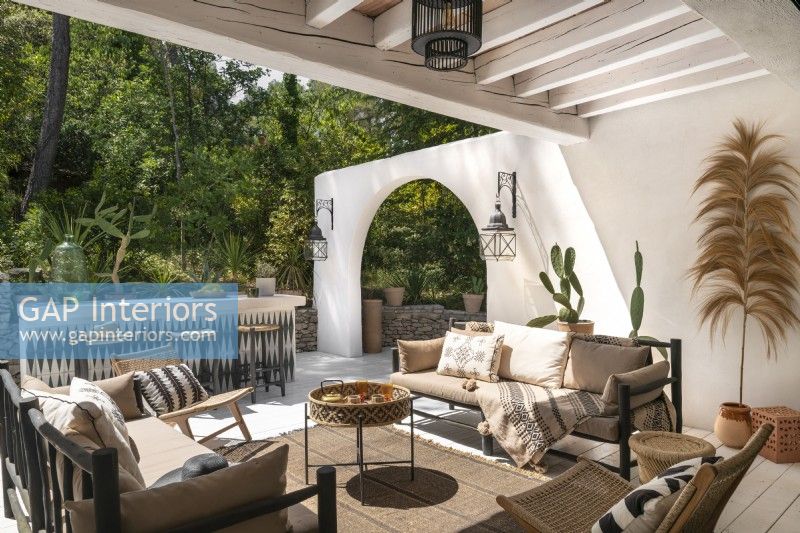 Partially covered outdoor living area on large terrace