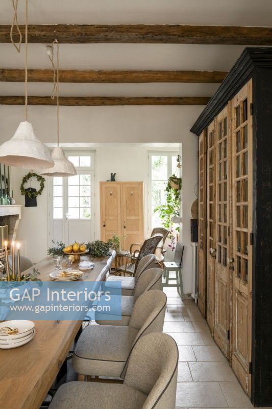 Stripped wooden doors in modern country dining room at Christmas 