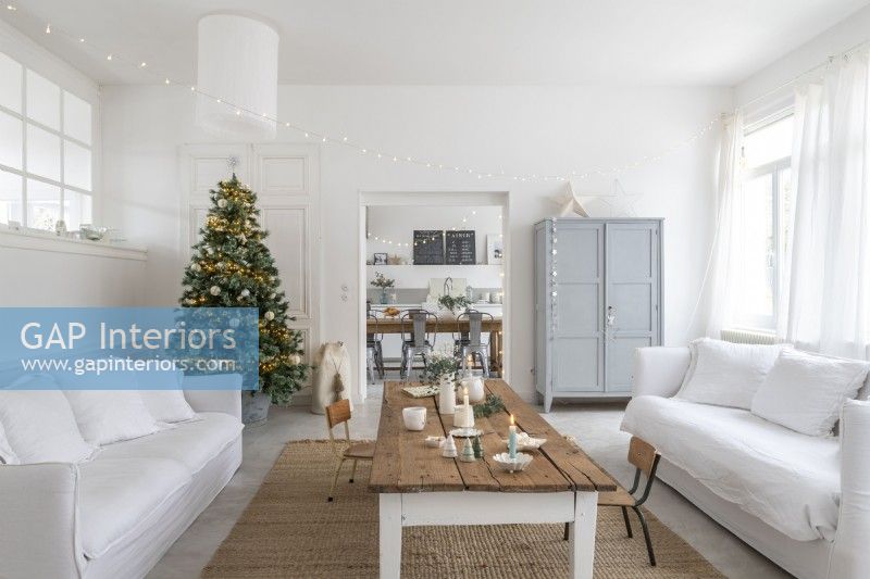 White painted modern country living room decorated for Christmas