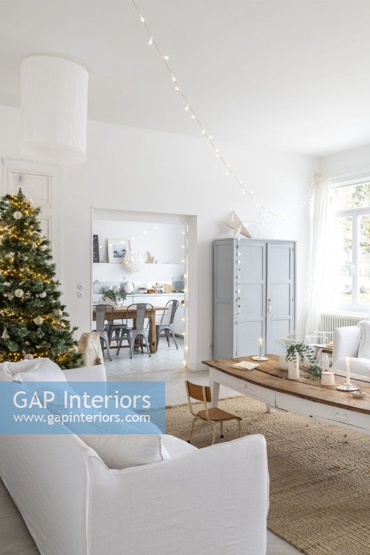 White and grey modern country living room decorated for Christmas
