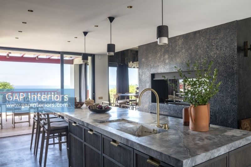 Contemporary grey kitchen with marble island worktop 