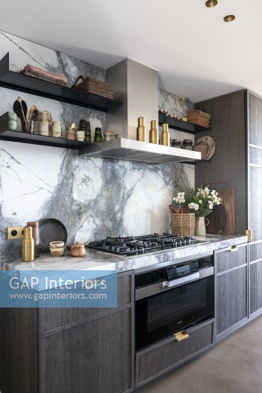 Grey contemporary kitchen with marble splashbacks 