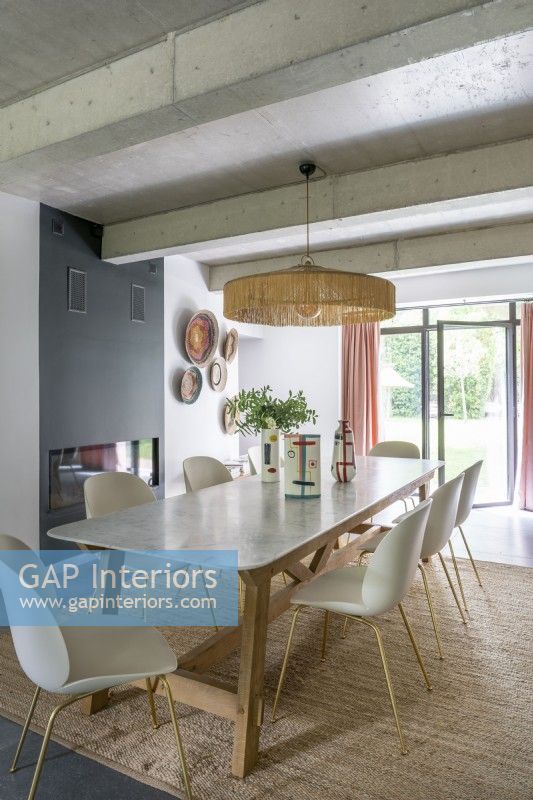 Modern dining room with open French windows in summer 