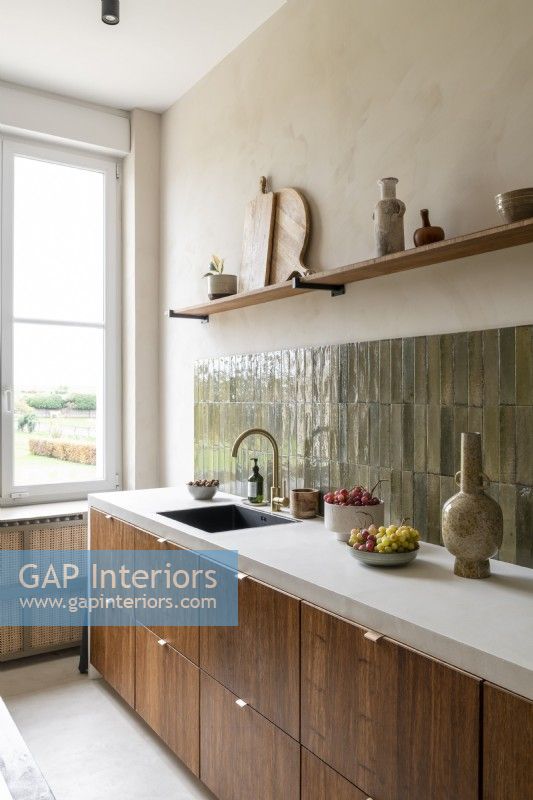Stone tiled splashbacks in modern wooden kitchen