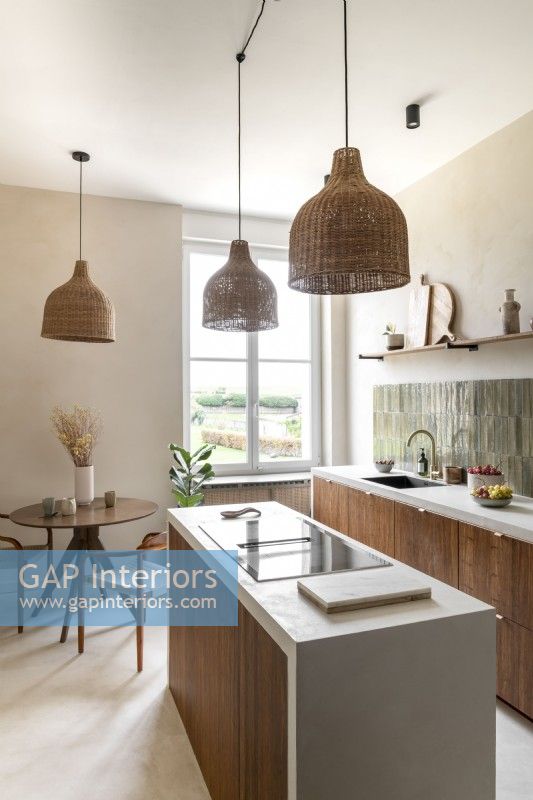 Narrow island and small round table and chairs in modern kitchen