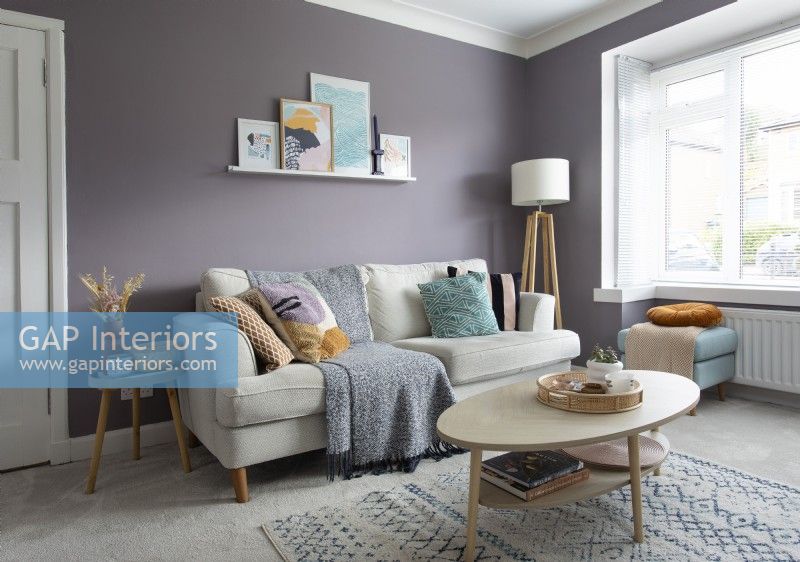 Modern living room with purple painted walls

