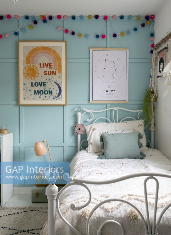 Blue painted panelled wall in modern childrens bedroom