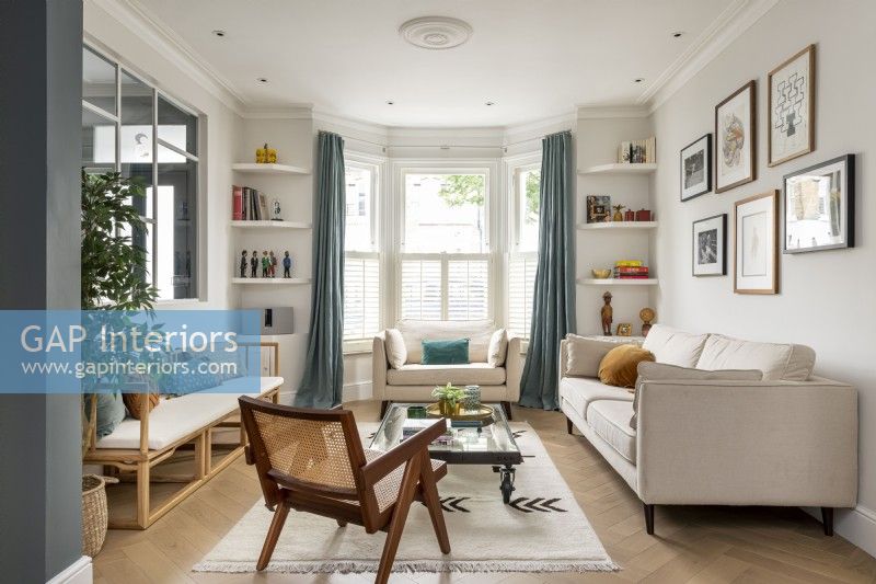 Classic contemporary living room with crittall style window.