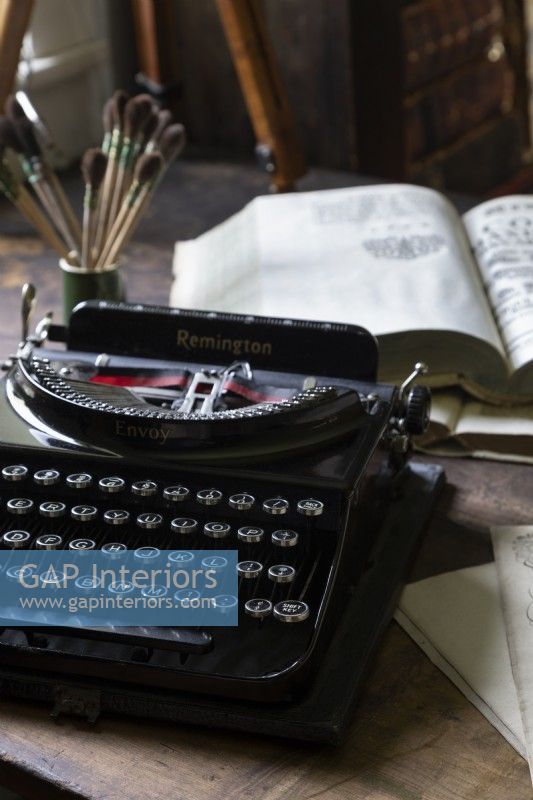 Detail of vintage typewriter on wooden desk