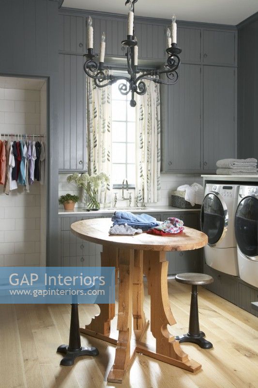 Upscale laundry room with gray walls