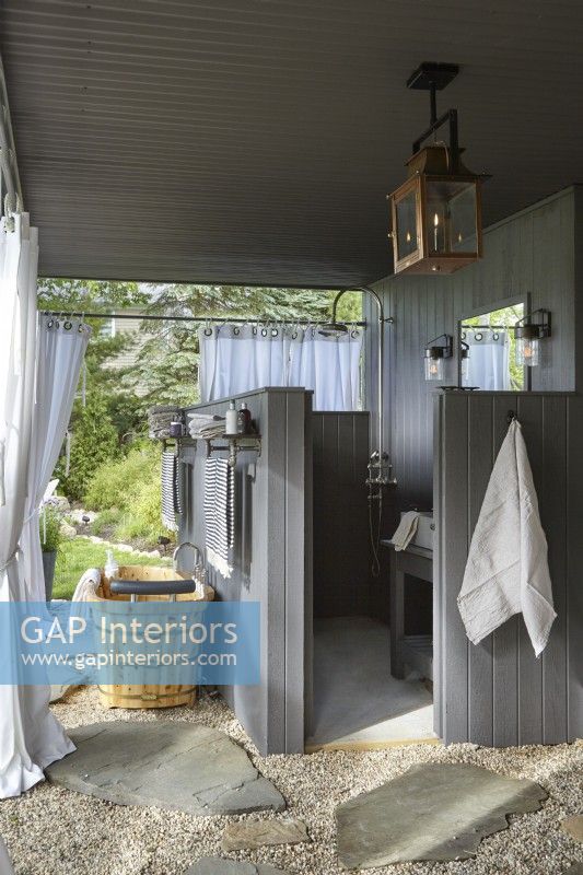 Outdoor bathroom with shower, sink and tub