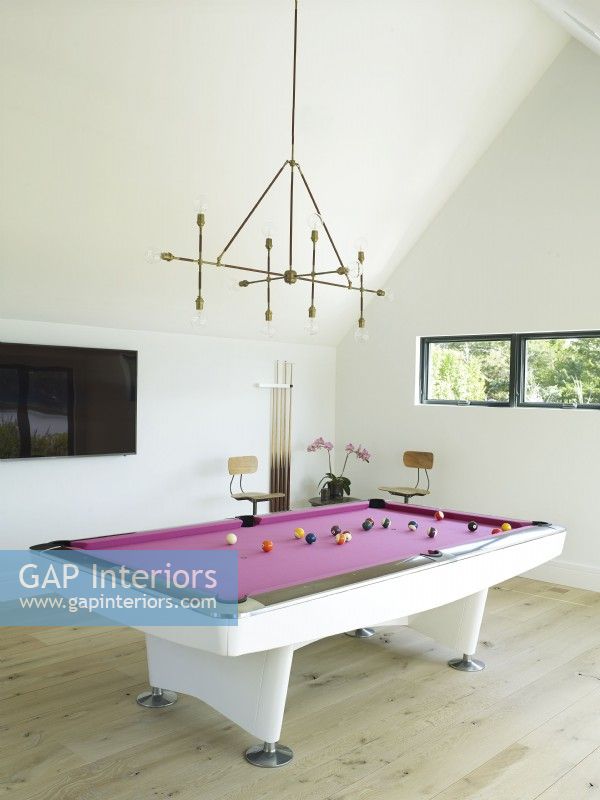 Game room with pink felt pool table