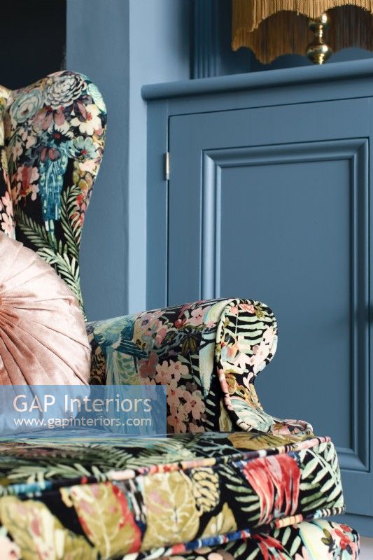 Bold botanical velvet patterned wingback armchair