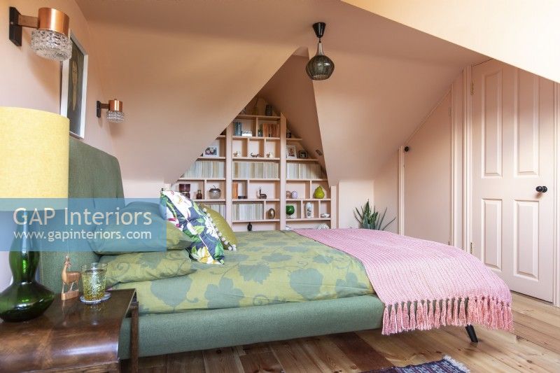 Colourful loft room with storage ideas