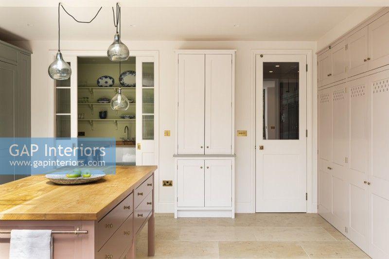 Contemporary classic kitchen with pantry and storage.