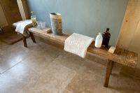 Boonshill Farm, East Sussex. Interior of bathroom with wooden bench with mother of pearl inlay from india. 