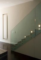 Contemporary hallway with stylish staircase with built in lighting