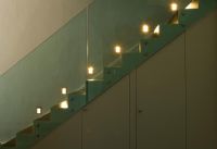 Contemporary modern staircase with lighting and storage cupboards underneath