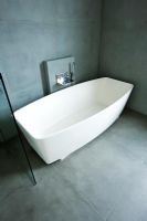 Modern slate tiled bathroom with contemporary  freestanding bath