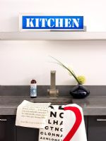Modern kitchen with sign above sink