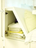 Detail of concealed storage compartment in cabin bed