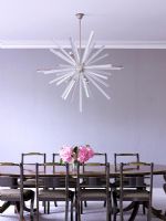 Dining room with classic dining table and contemporary chandelier


