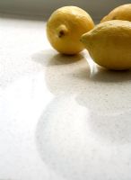 Detail of lemons on kitchen worktop 