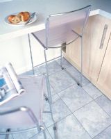 Modern kitchen with breakfast bar and light grey floor tiles