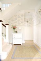 Classic hallway with wallpaper above dado rain and wood panels below
