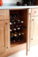 Concealed wine rack in kitchen cupboard