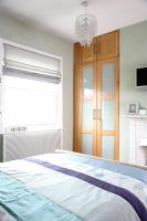 Modern bedroom with double bed and built in wardrobe